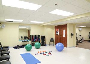 Room with fitness equipment for rehabilitation