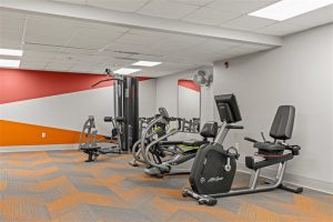 Fitness center at Cedar Crest Wellness Center with exercise bikes and strength equipment.