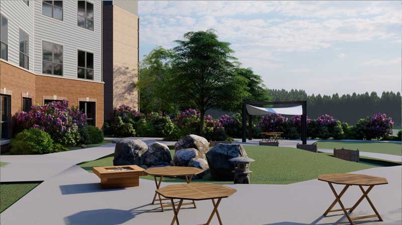 Picnic area outside building's exterior for 2023 expansion