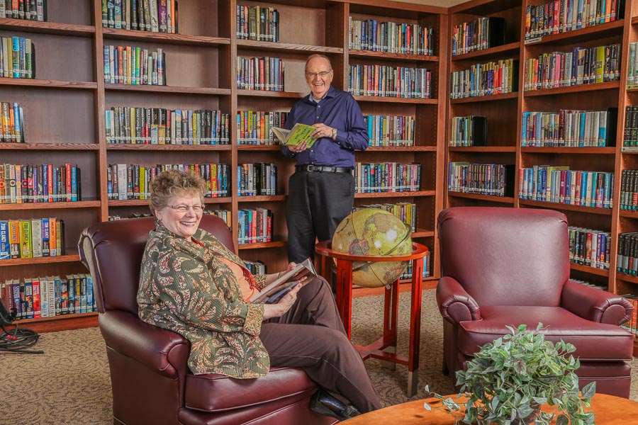 Two residents in the Cedar Crest Library
