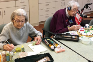 Residents painting pottery