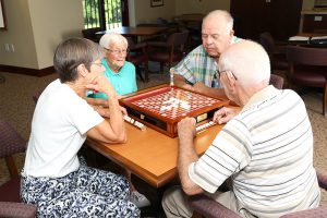 Group of residents playing Scrabble