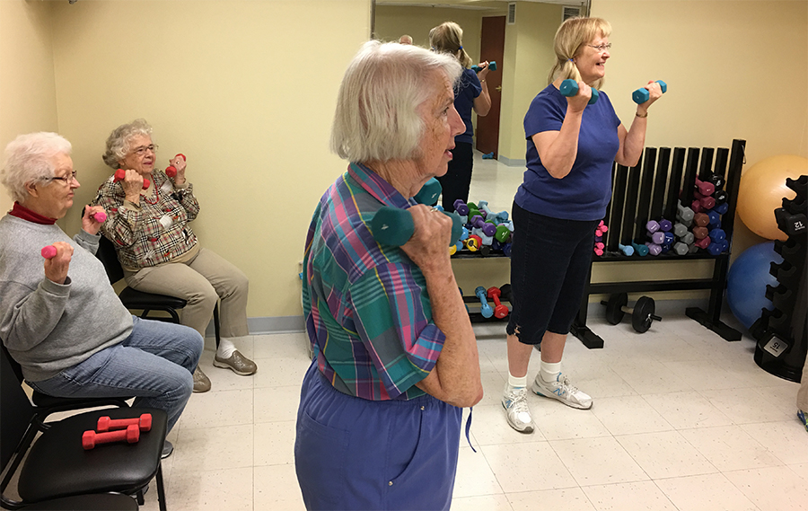 Residents lifting hand weights